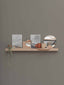 Étagère modulaire en bois massif au style minimaliste, idéale pour organiser et exposer de petits objets avec élégance